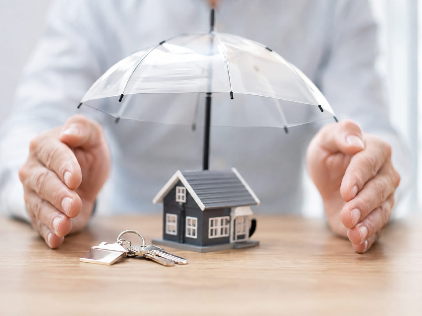 A model home protected beneath an umbrella
